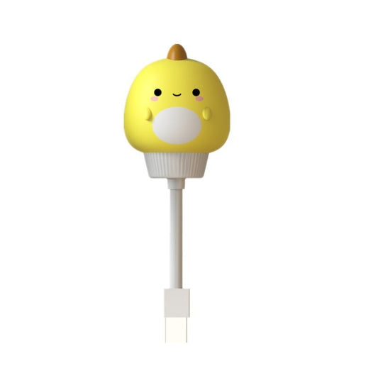 Duck-shaped plug-in night light with green body, smiling face, and two-prong plug