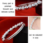 Silver-tone beaded bracelet with smooth round beads and hinged cuff design