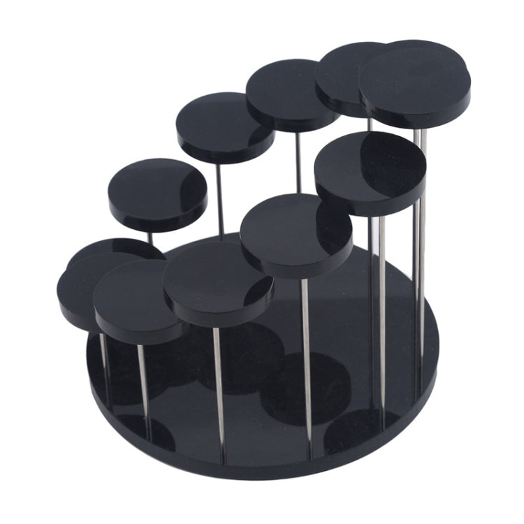Black acrylic ring display stand with round pegs, metal stems, and circular base