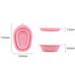 Pink silicone makeup brush cleaning pad with oval loop and textured inner scrub grid.