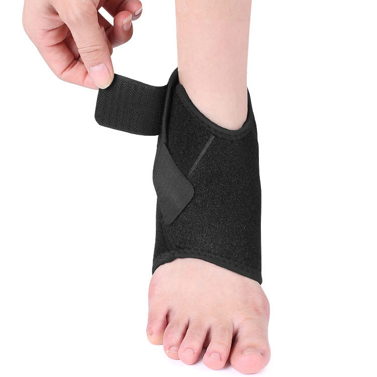 Black ankle support brace being adjusted, showing padded wrap across heel
