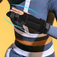 Black finger splint brace secured on wrist over a striped long-sleeve shirt