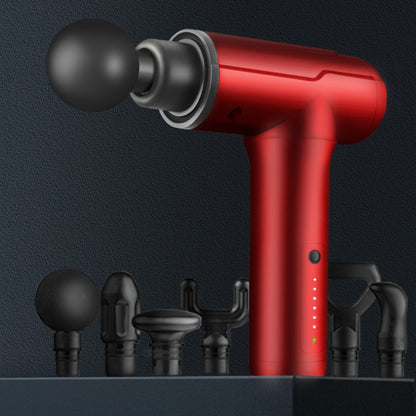 Red mini massage gun with round ball head and multiple black attachment heads