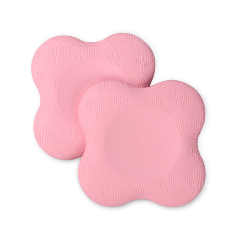 Pair of pink flat yoga elbow and knee pads with textured swirl grip surface