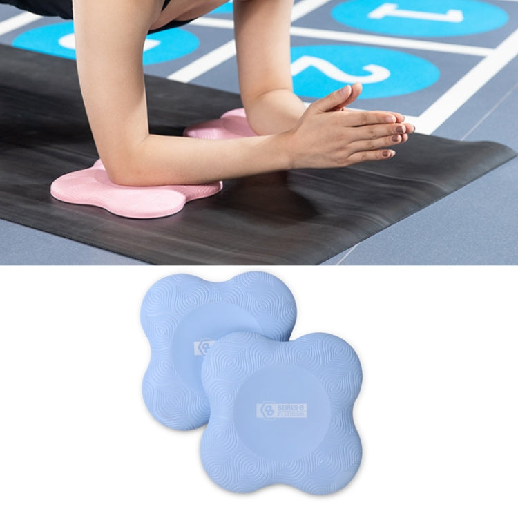 Pair of light blue flat yoga elbow and knee pads with textured swirl grip surface