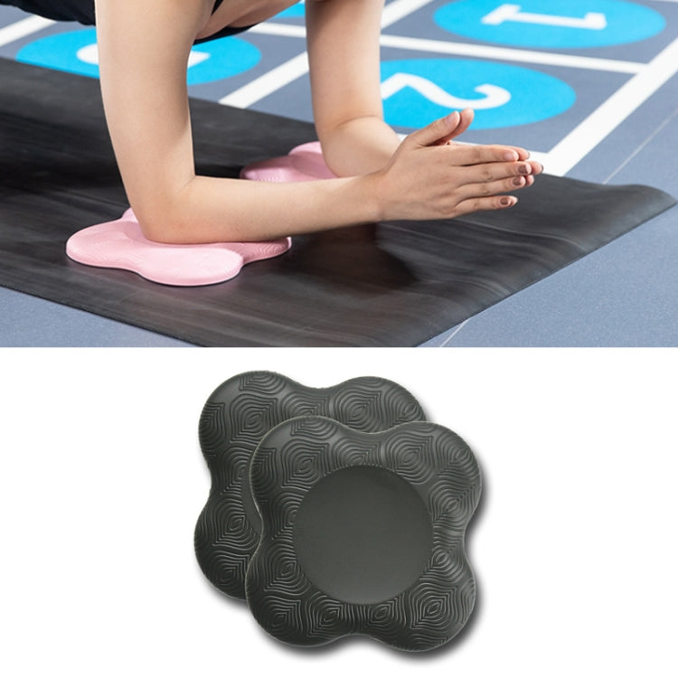Pair of dark gray flat yoga elbow and knee pads with textured swirl grip surface