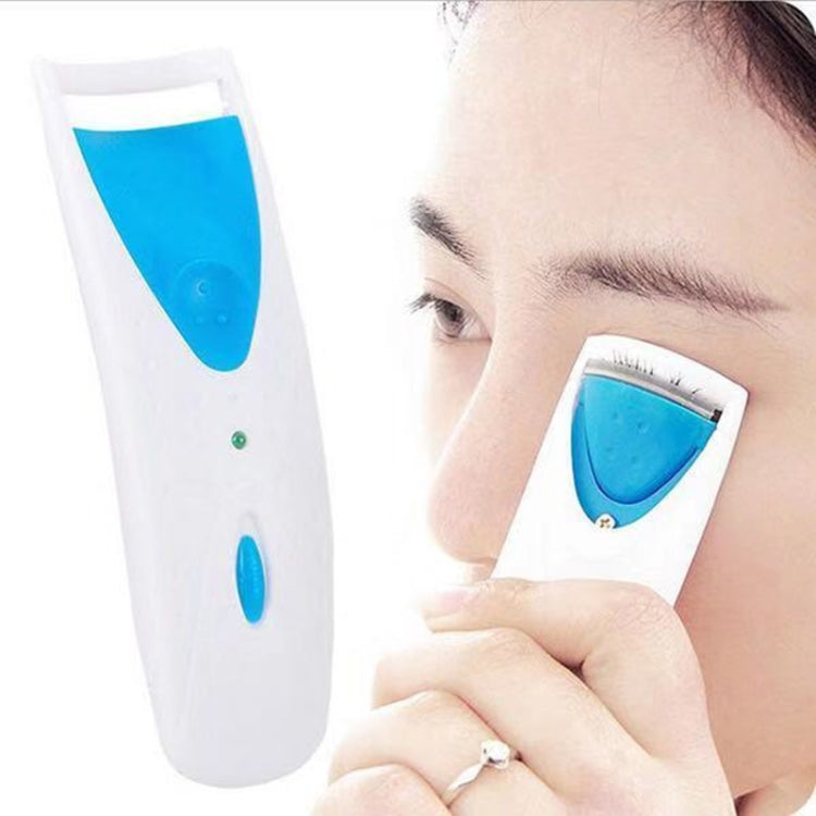 Blue electric heated eyelash curler with white body and curved silicone strip