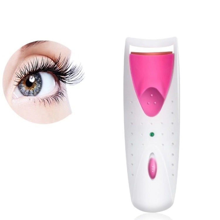 Electric heated eyelash curler with pink silicone strip and white body
