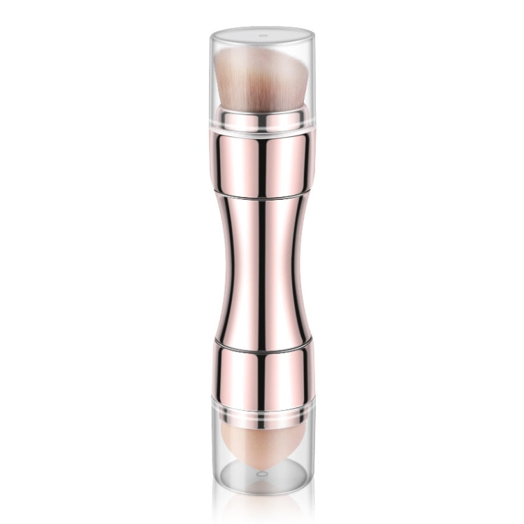 Rose gold retractable metal makeup brush with soft rounded bristles and clear cap