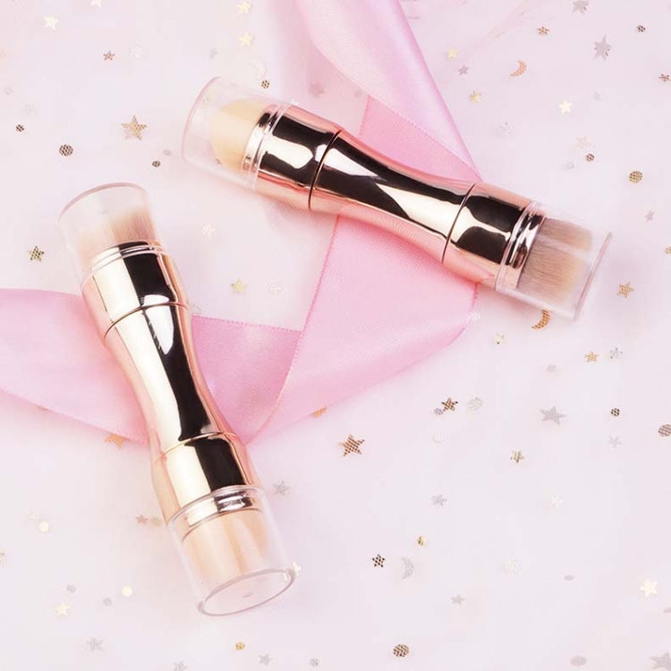 Rose gold retractable makeup brush pair with rounded bristle heads in clear caps