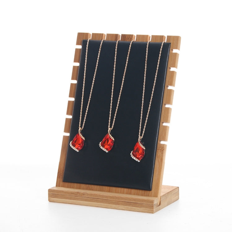 Bamboo jewelry storage display stand with black felt panel and three necklace hooks