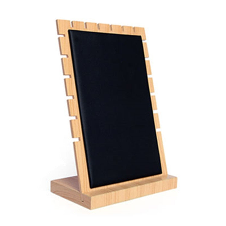 Bamboo jewelry display stand with dark rectangular panel and slotted base