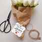 Kraft paper gift tag with 'Thank you for celebrating with us' text, tied with twine