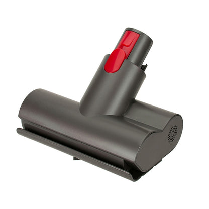 Dark gray vacuum cleaner mite removal nozzle tip with red release button