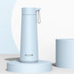 Light blue stainless steel portable thermos cup with carry loop and flip-top lid