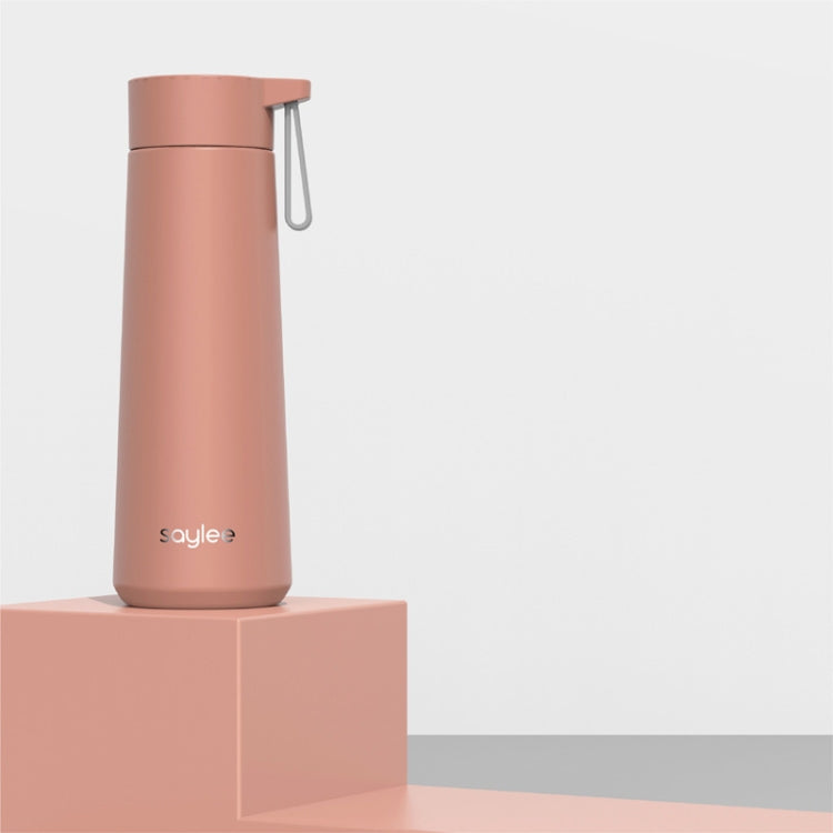 Dusty pink stainless steel portable thermos cup with carry loop and flip-top lid