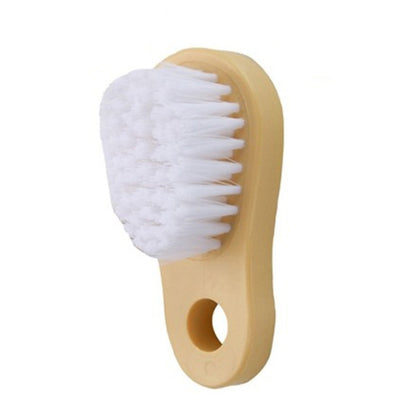 Soft bristle cleaning brush with white brush head and tan handle
