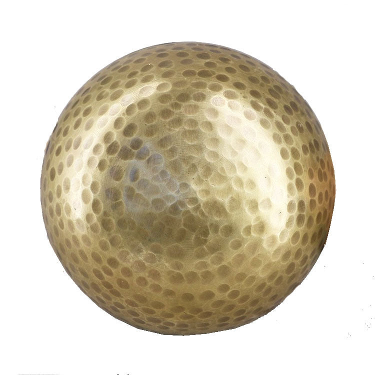 Buddha metal sound bowl close-up with hammered texture