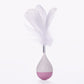 Feather tumbler cat toy with white feathers and light purple-and-pink base