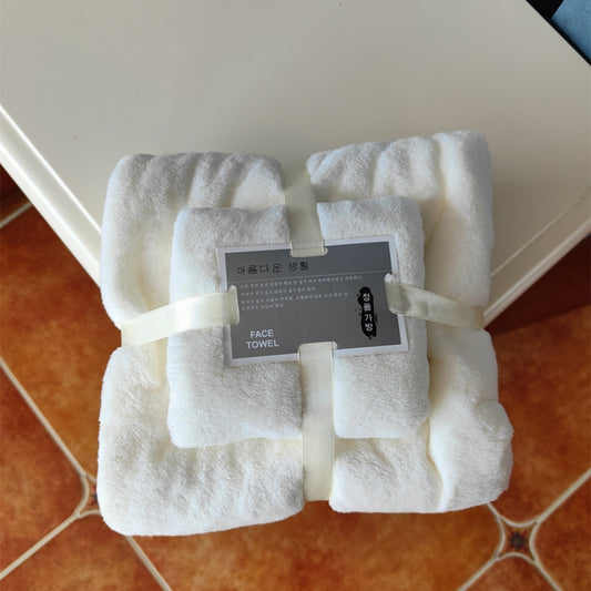 White coral fleece bath towel set, folded bundle with fabric strap ties