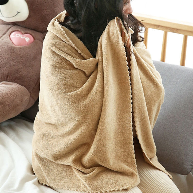 Beige coral fleece towel wrap for lounging, draped over shoulders