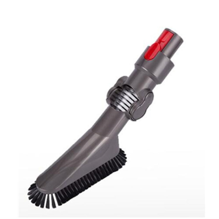 Gray folding vacuum brush head with black bristles and red release button, angled