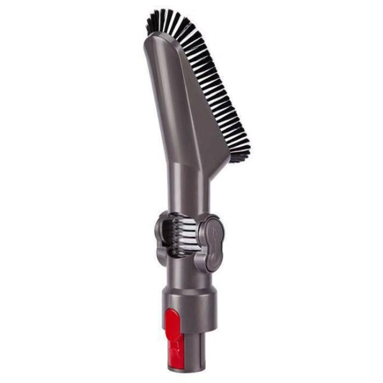 Gray rotating vacuum brush head with dense black bristle strip and red indicator