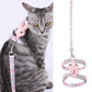 Adjustable cat leash with rabbit head charm and pink patterned strap, quick metal clip closure