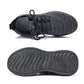 Black knit lace-up sneakers with textured tread outsole, side and heel view
