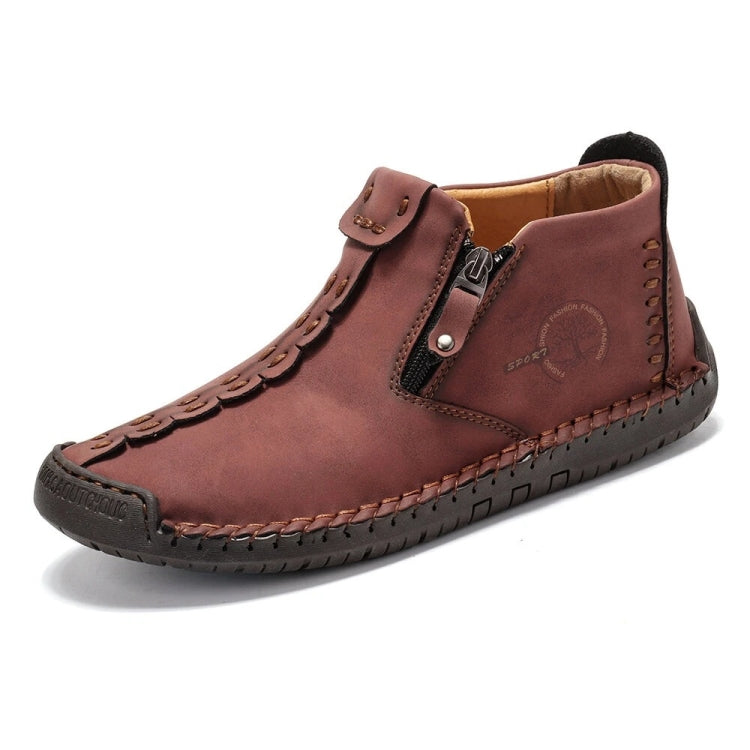 Brown leather ankle boots with side zipper, buckle strap, and contrast stitching