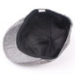 Gray burlap beret cap interior with black lining and stitched panels