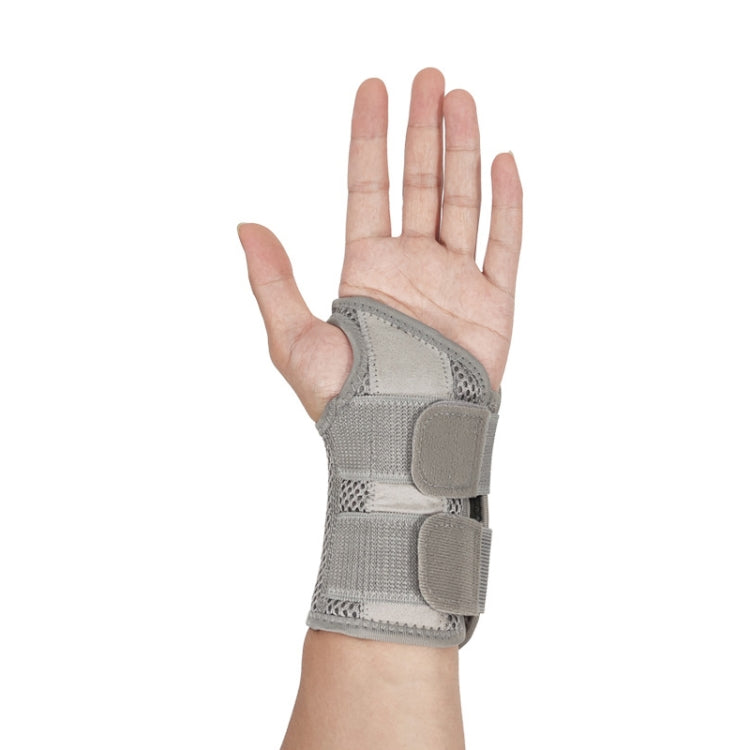 Gray breathable wrist guard with two adjustable straps and rigid support pad