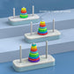 Rainbow Tower of Hanoi stacking toy set with three bases and multicolor ring stacks