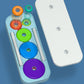 Color disc pieces and white rods for Tower of Hanoi stacking toy in a plastic tray