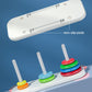 Tower of Hanoi stacking toy parts with rods, base, and colorful ring discs