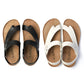 Pair of cork flip-flop sandals, black and white leather with crossover straps