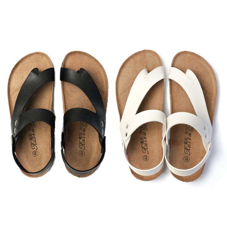 Pair of cork flip-flop sandals, black and white leather with crossover straps