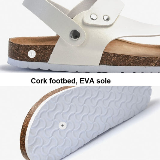 White slide sandals with cork footbed and textured EVA sole tread