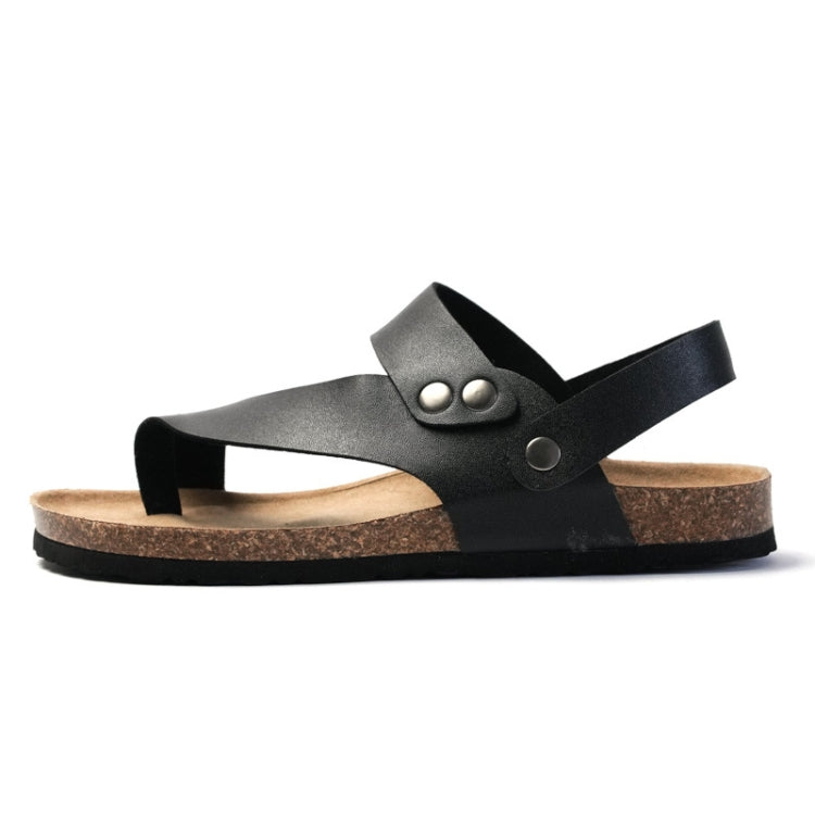 Men's black cork flip-flop sandal with wide strap and circular metal eyelet on upper