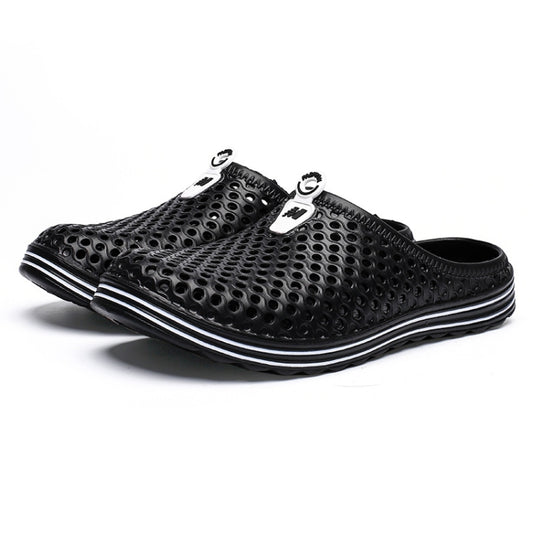 Black perforated slide sandals with white trim and circular ventilation holes