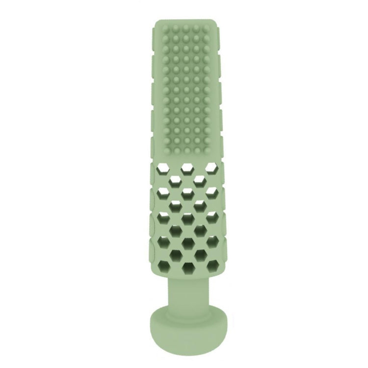 Green toothpaste-shaped dog teething bite toy with raised cleaning bumps on TPR