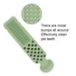 Green toothpaste-shaped dog teething bite toy with rounded handle and raised cleaning bumps