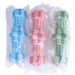 Pack of assorted hexagonal molar dog chew toys in light blue, pink, and green