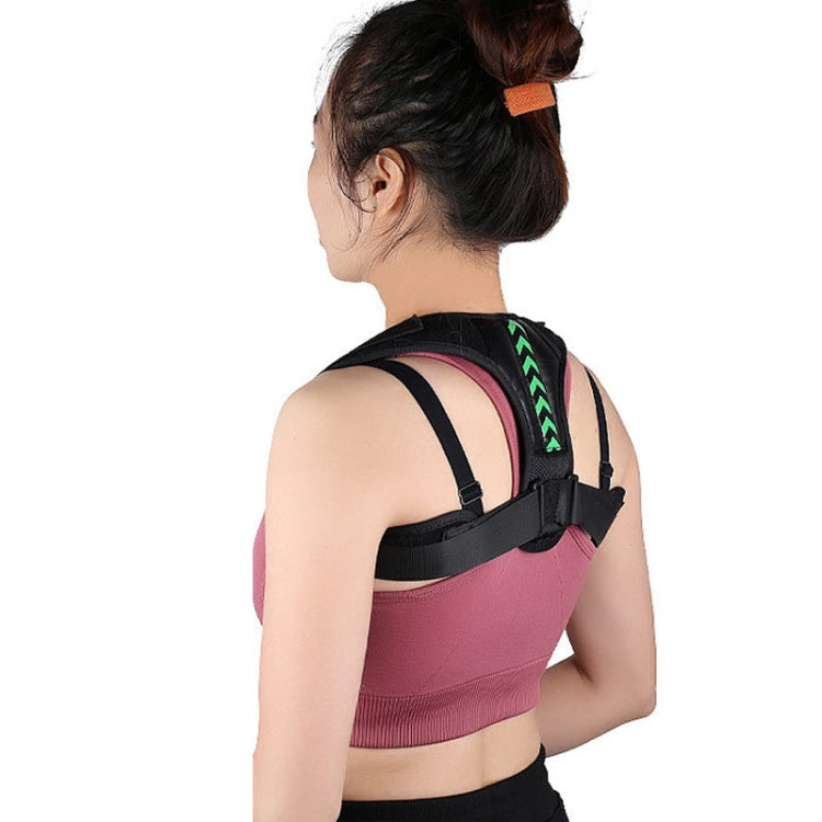 Black open-shoulder posture correction belt with green chevron panel and adjustable straps