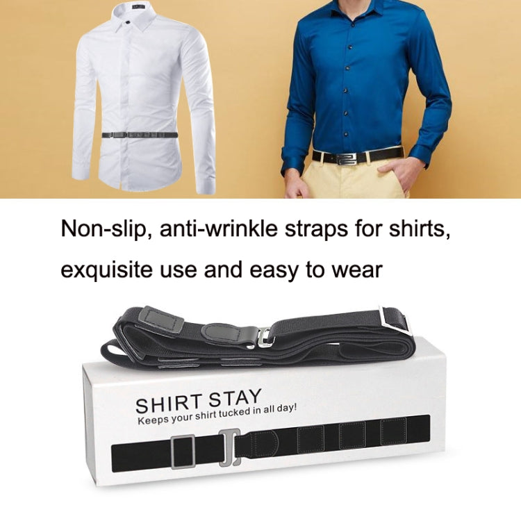 Black shirt stay strap laid on box, worn across a button-up shirt