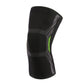 Black nylon sports knee sleeve with textured protective pads and green side stripe