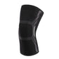 Black nylon sports knee sleeve with textured protective pads and gray geometric stripes
