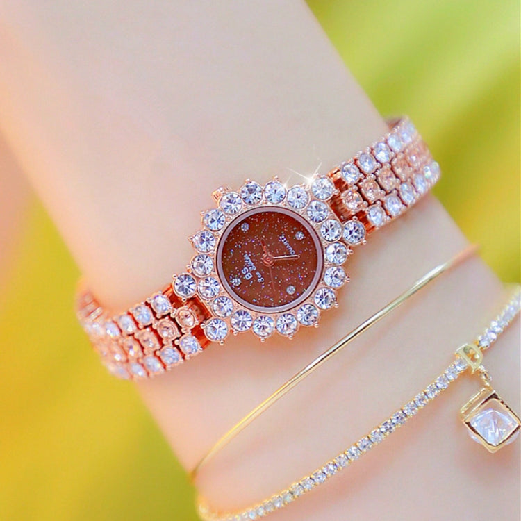 Women’s sparkling chain watch with dark brown dial and rose-gold tone rhinestone band