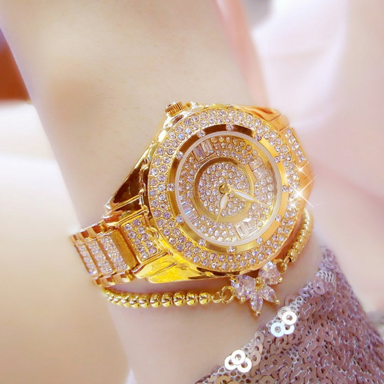 Gold-tone ladies watch with crystal-like center dial and hinged link bracelet
