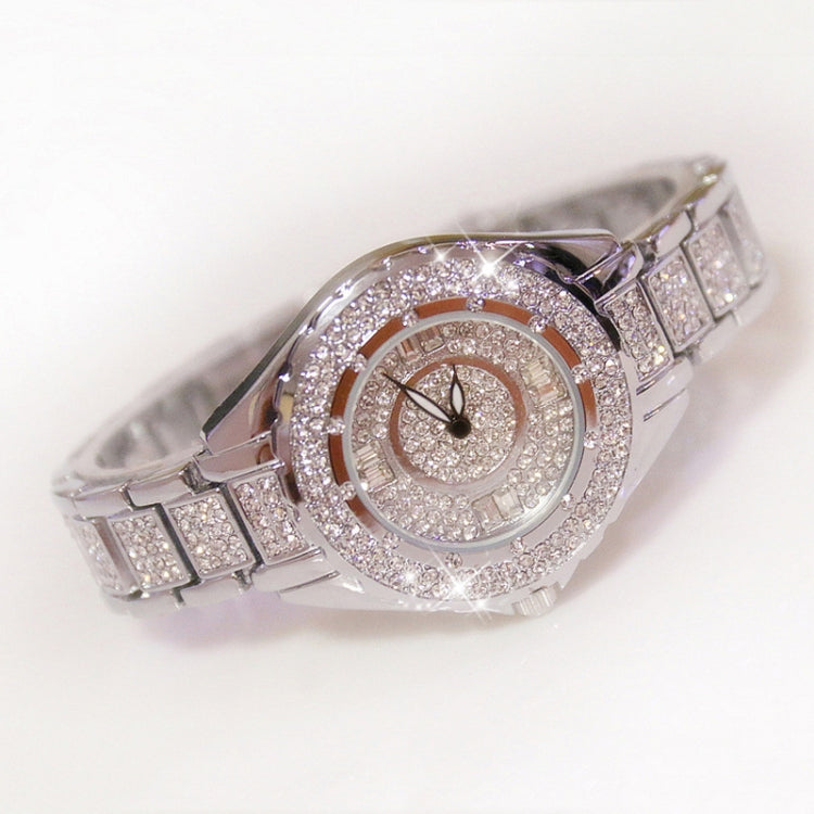 Silver-tone ladies watch with oval crystal bezel and segmented link band